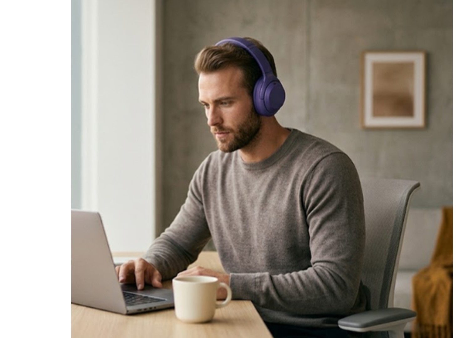 Focused man working with headphones
